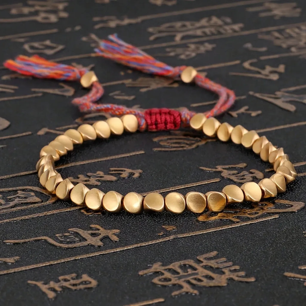 Hand-woven adjustable alloy tassel bracelet in electroplated colour T131 on neutral background