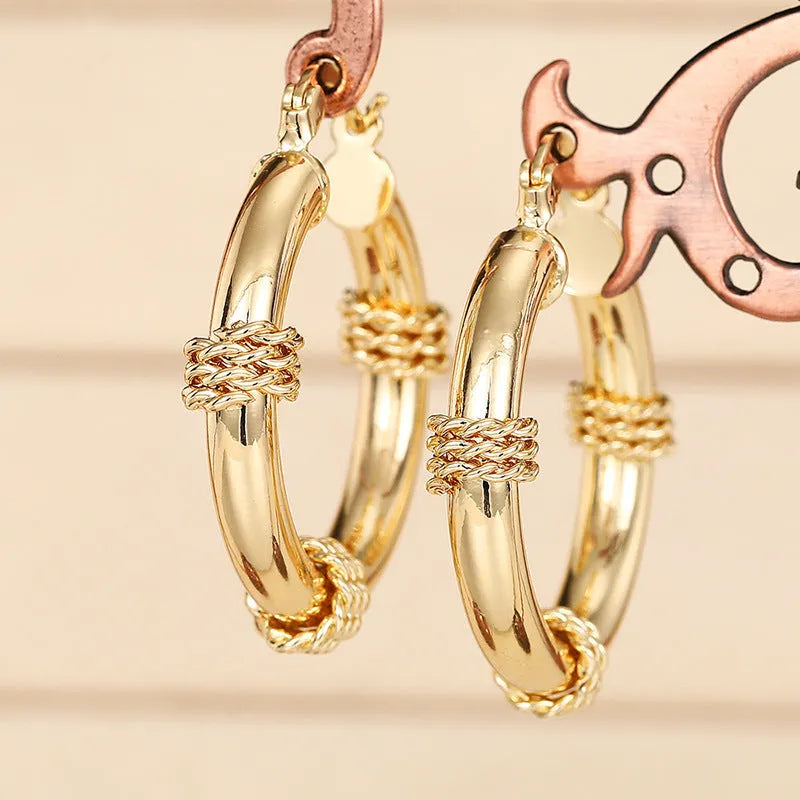Geometric golden copper earrings with ring and line design elements for women