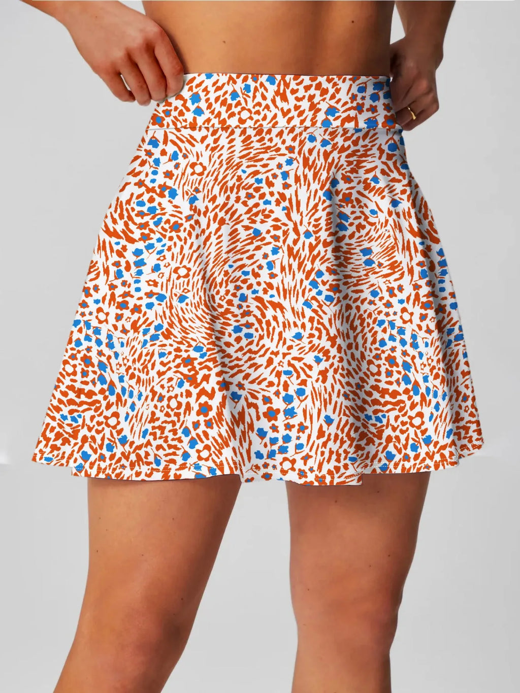 Women's high waist half-length sports skirt in blue, shown for golf or tennis wear.