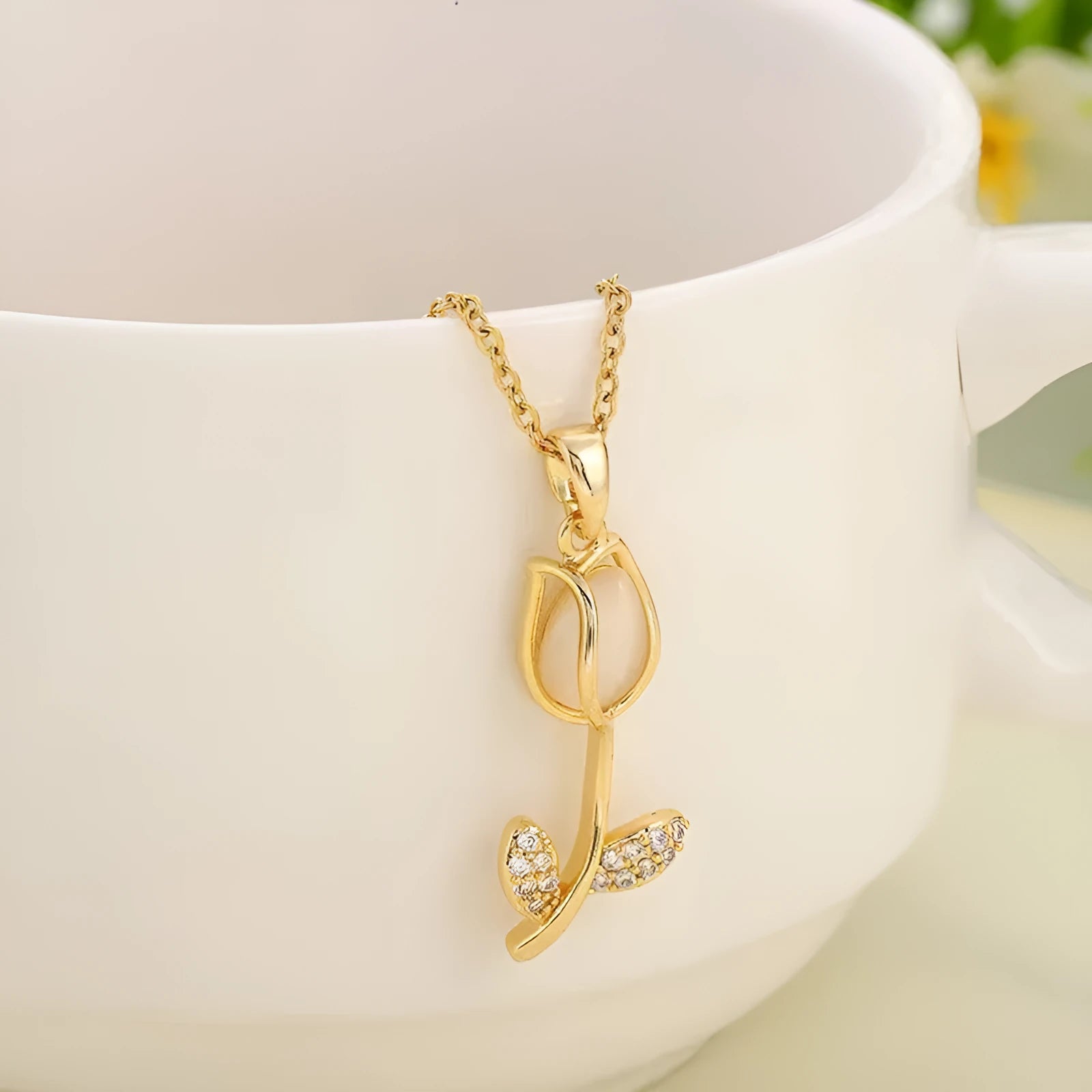 Zircon tulip pendant necklace for women in gold tone on a titanium steel chain.