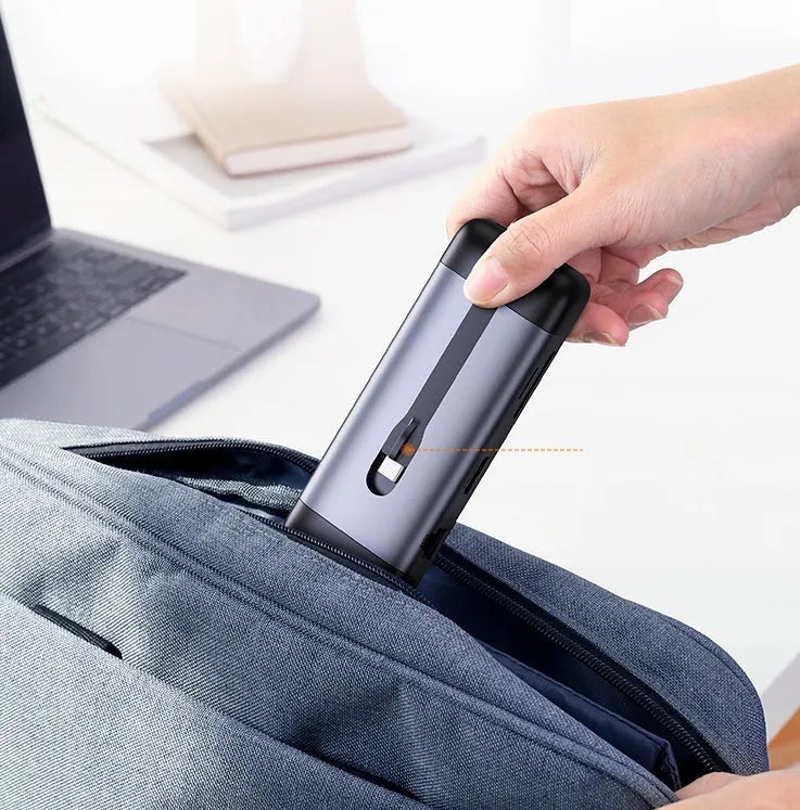 A compact USB-C docking station hub with ports for HDMI, VGA, Ethernet, USB 3.0, and power delivery.