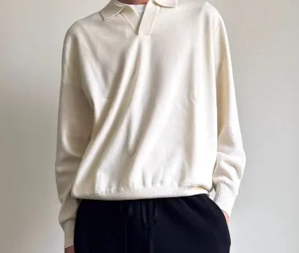Pure wool polo sweater with lapel collar in loose fit, shown in navy blue colour.