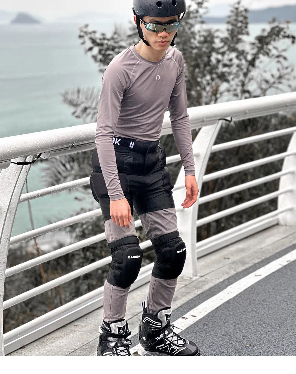 Black adult hip pad for sports protection, showing adjustable waistband and NBR padding on Spandex material.
