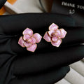 Golden-purple oil-spot glaze flower stud earrings with gold-plated silver needle detail on copper.