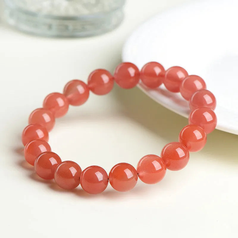 Natural cherry red agate scattered bead bracelet with polished stones, shown in various size options.