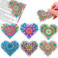 Set of six handmade PU leather bookmarks with crystal floral cornerites on a white background.