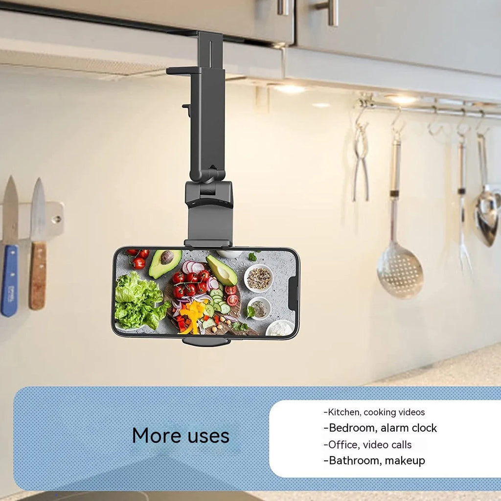 Black foldable and rotating universal mobile phone holder made from ABS plastic on a flat surface.