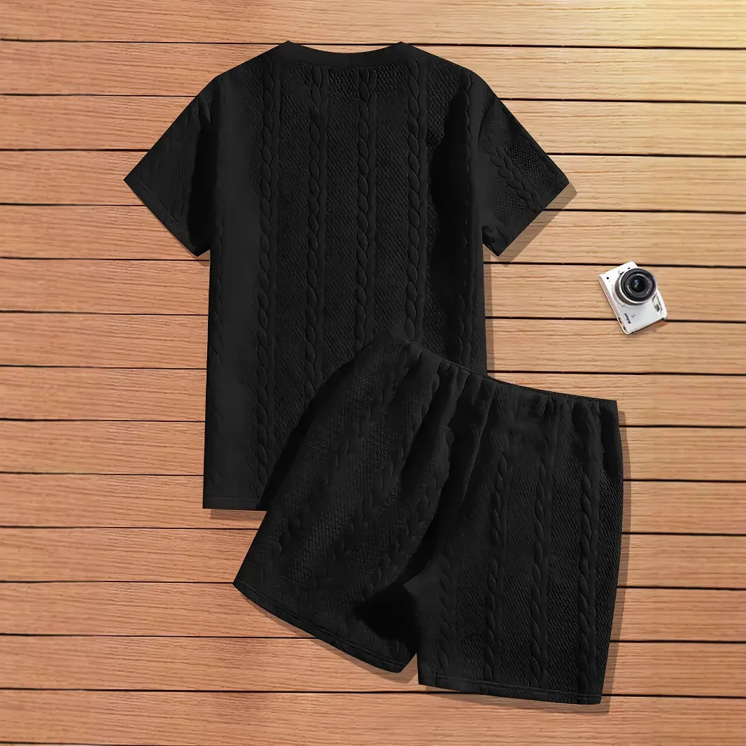 Men's black sports two-piece set with ribbed short sleeve top and matching shorts