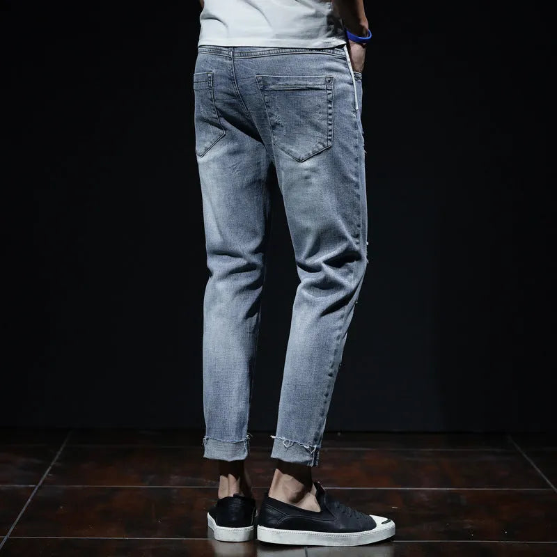 Light blue youth ripped stretch denim cropped skinny jeans mid-waist zip fly