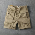 Men's straight-cut cotton cargo shorts in Army Green with multiple pockets and stretch fabric.