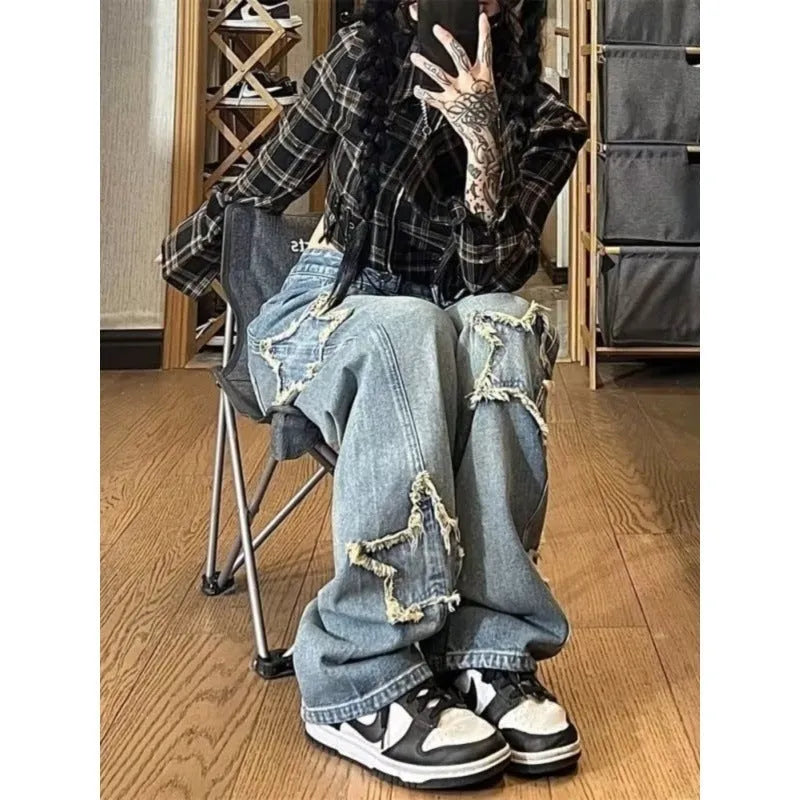 Blue high-waist wide-leg denim jeans with straight-leg fit on hanger