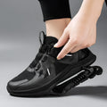 Black running shoes with mesh upper, leather stitching detail, and a buckle closure on the middle top.