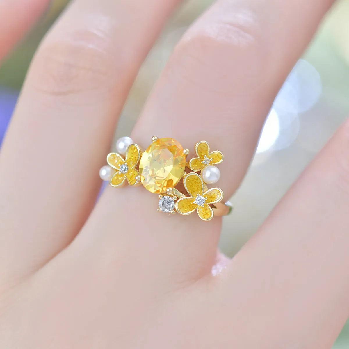 Women's flower pearl zircon open ring in yellow and light purple colours with floral design