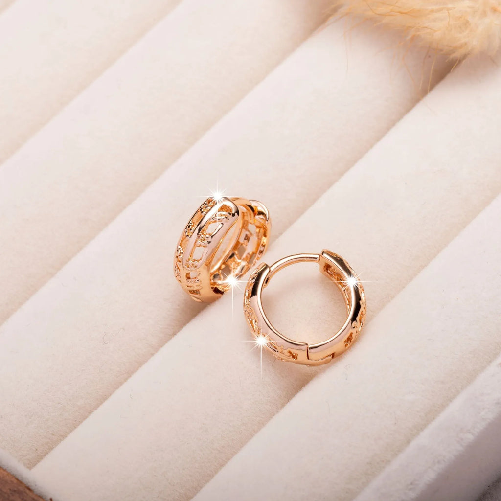 Rose gold hollowed-out copper earrings in heart and leaf shapes