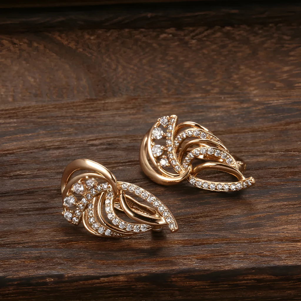 Women's copper ear clips with wing design featuring micro inlaid zircon detailing and gold-plated finish in H0195 colour