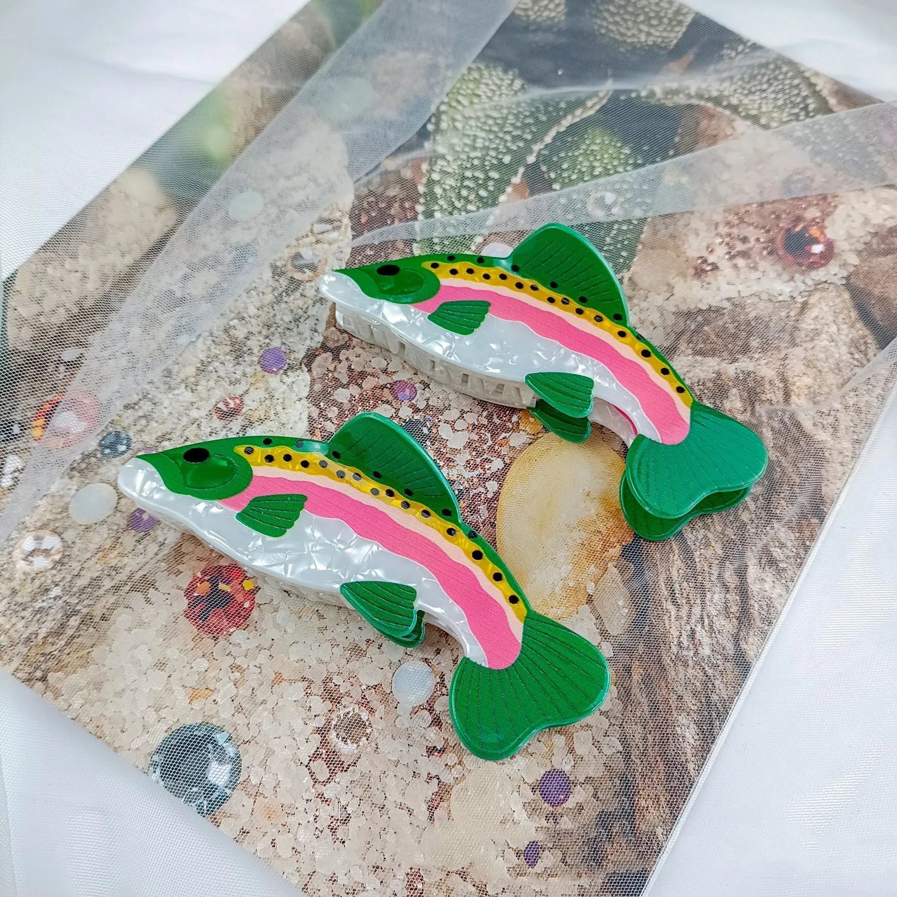Dark green PVC hair clip with printed rainbow trout marine design