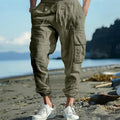 Men's casual ankle-tied linen trousers in Army Green colour showing multi-pocket design