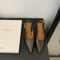 Thin low heel strap pointed leather shoes in black, red, brown, or silver on a rubber sole.