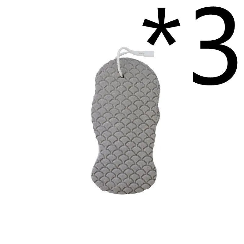 White 3D bath sponge with fish scale pattern for gentle body exfoliation in shower.