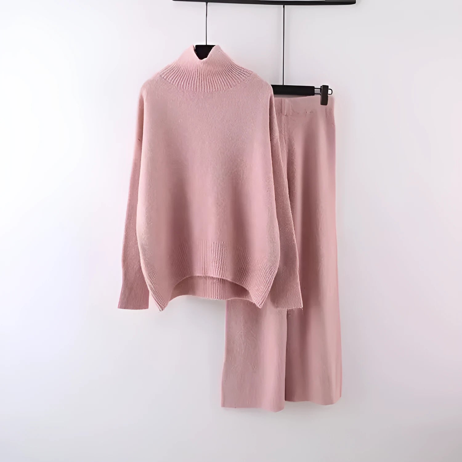 Women's beige acrylic sweater and wide-leg trousers casual two-piece set on a hanger.