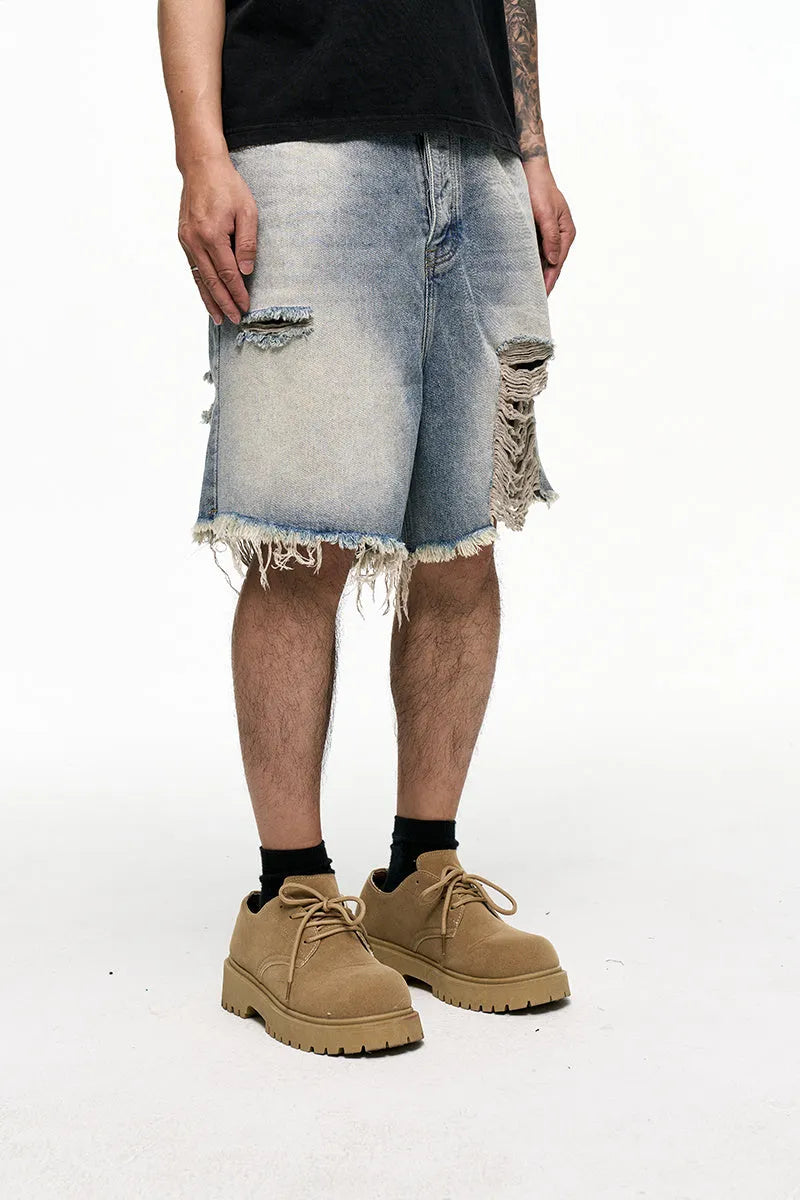 Men's light blue baggy denim shorts with wide leg cut and zip fly
