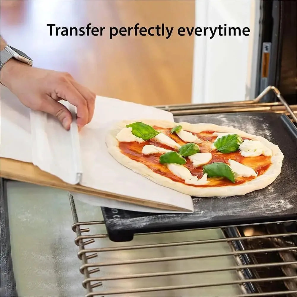 White food-grade PP plastic pizza transfer shovel with handle and hanging hole.