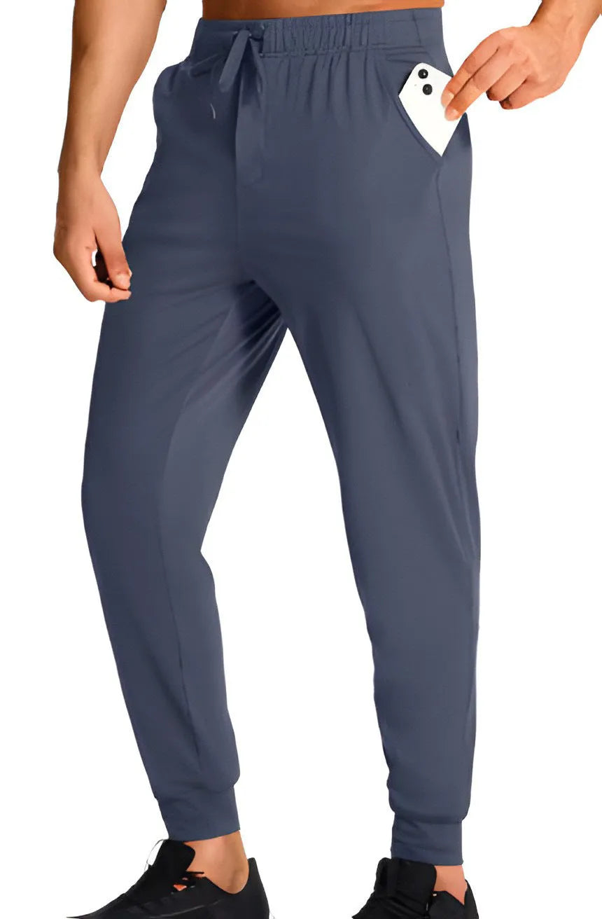 Men's loose fit polyester trousers in solid colour available in multiple sizes