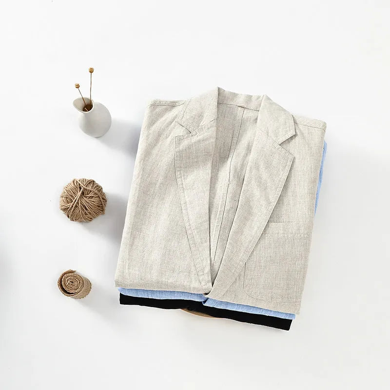 Men's thin solid-colour linen suit coat with notch lapel and chest pocket on a hanger.