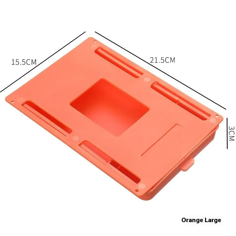 Small white plastic storage drawer with a cover and internal grid, shown placed under a wooden table.