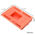 Small white plastic storage drawer with a cover and internal grid, shown placed under a wooden table.
