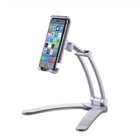 Silver aluminium alloy desktop stand holding a tablet at an angle, with adjustable clips and a white mounting base.