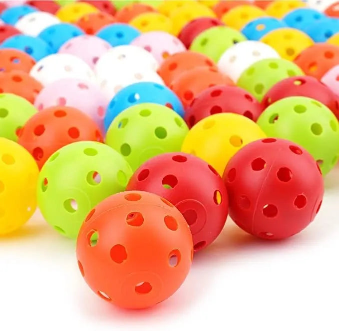 Multi-colour 42mm diameter golf practice balls with 26-hole design in a net pocket