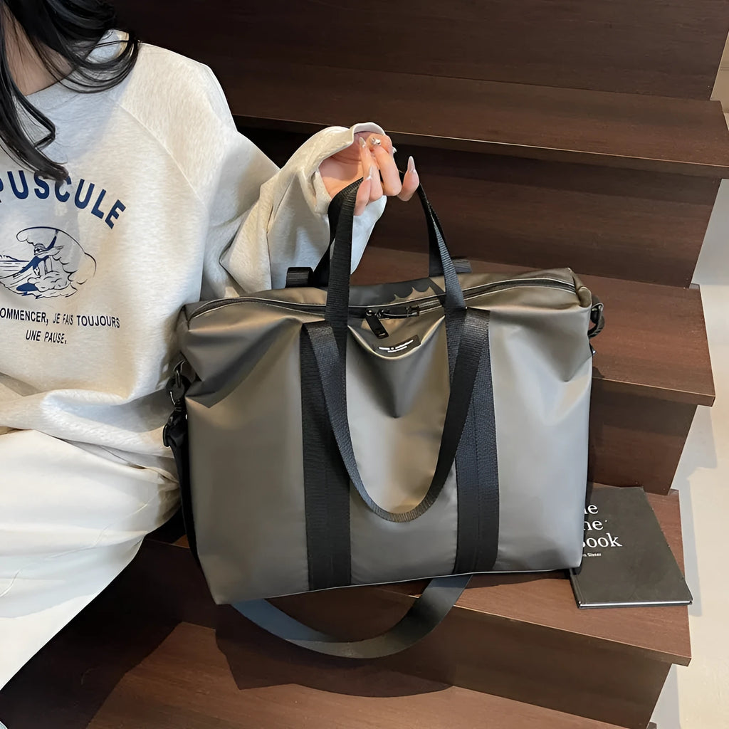 Lightweight Oxford cloth tote bag in black, grey, or champagne with 20-35L capacity for travel