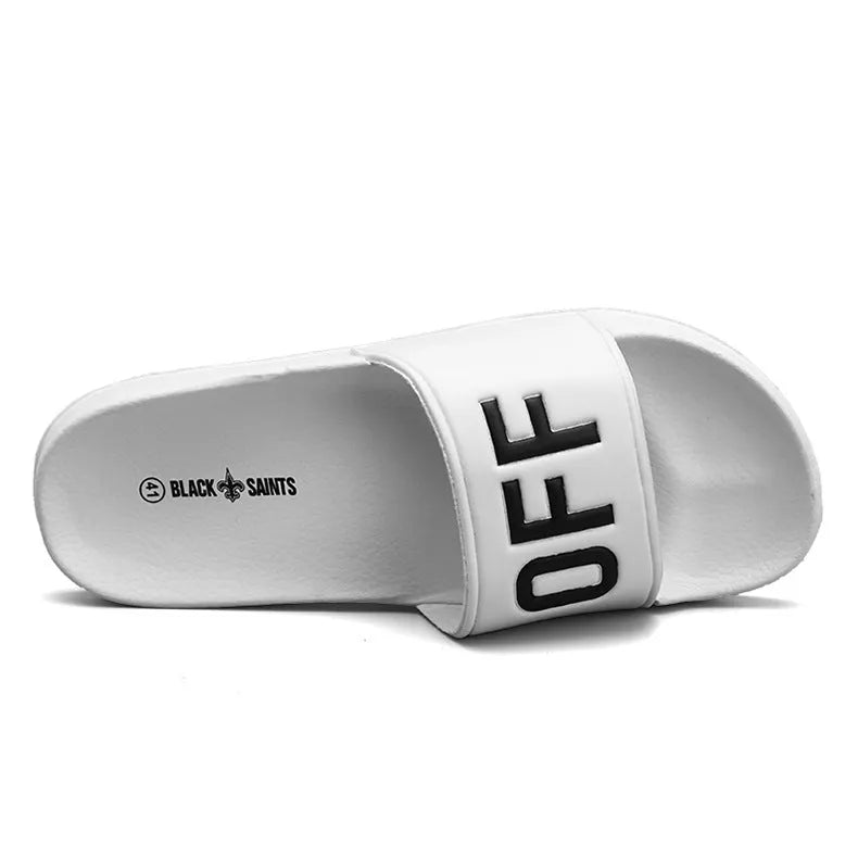 Men's black open-toe slippers with a soft viscose upper and textured rubber sole.