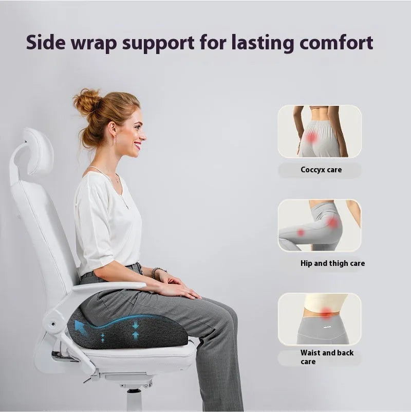 Solid colour memory foam office chair cushion in light grey on a chair.