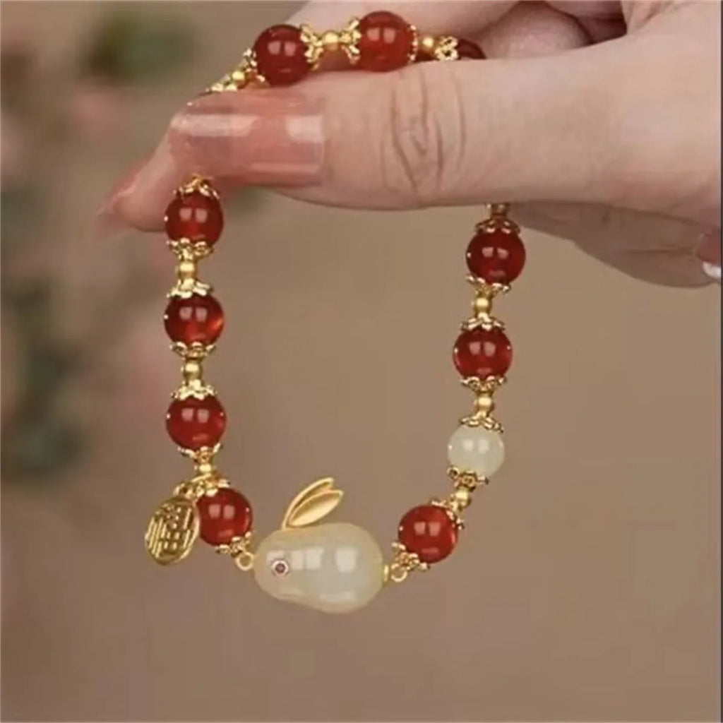 National style glass bracelet with rabbit charm and coloured glaze decoration