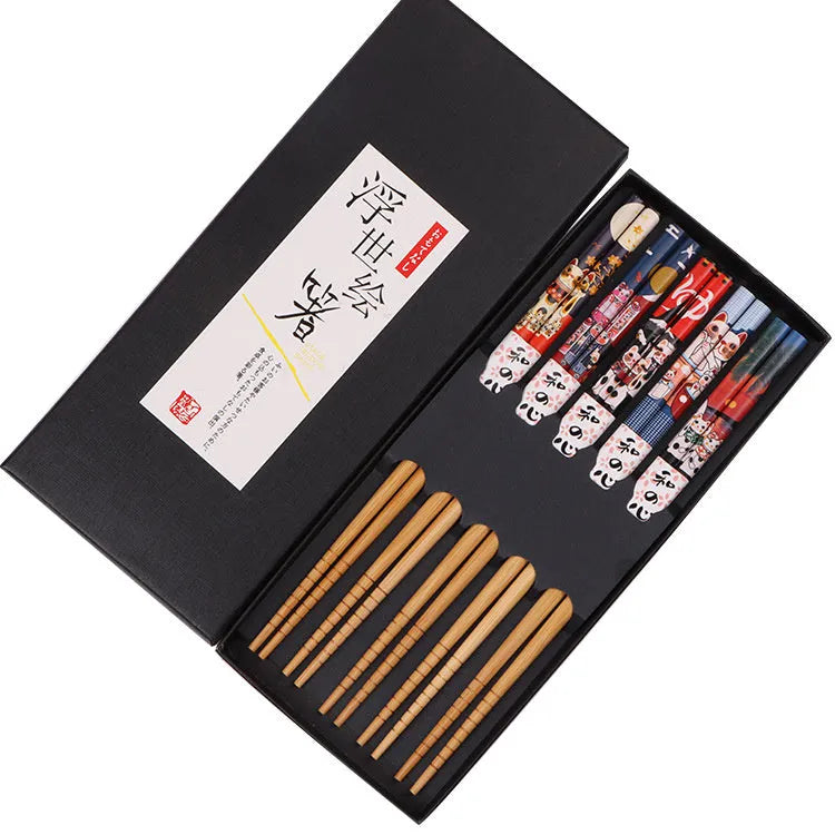 Set of five pairs of bamboo chopsticks with colourful Japanese lucky cat and elegant blue patterns.