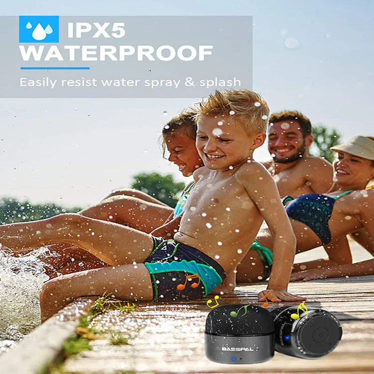 Black portable mini Bluetooth speaker with button controls and waterproof plastic shell.