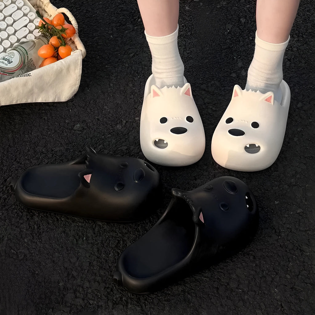 Women's black and white EVA puppy slippers with toe cap sandal design on a white background.
