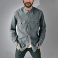 A man's regular fit denim cardigan coat in a khaki colour, shown on a hanger.