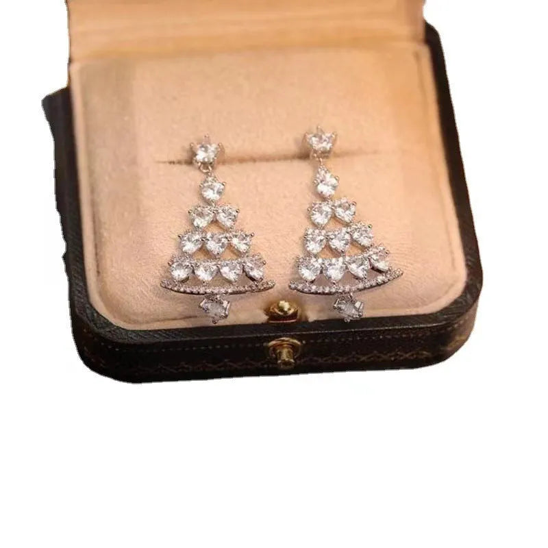 Women's silver needle Christmas tree earrings in geometric shape with bell motif, available in gold or silver