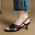 Retro light brown high heel sandals with thin cross straps and an ankle buckle on a square toe.