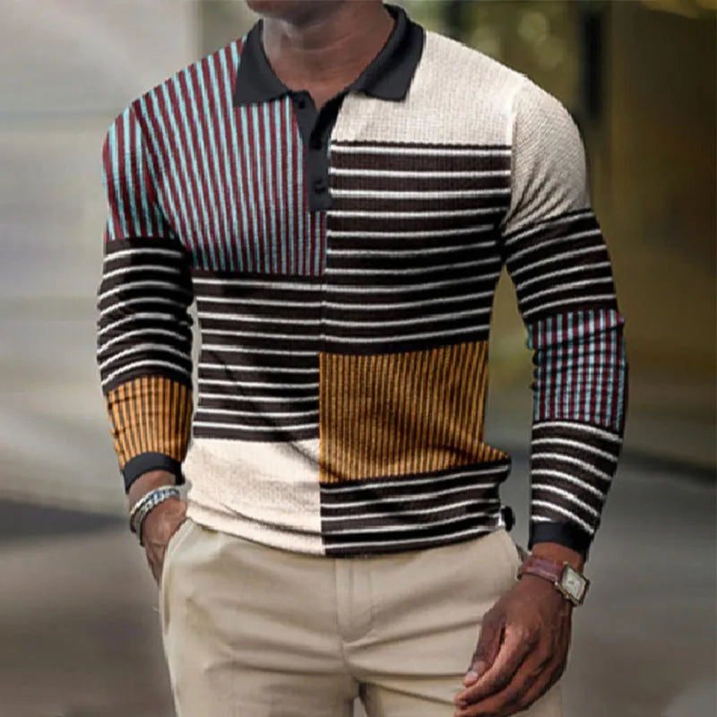Man wearing a grey striped long-sleeved top with a textured 3D printed pattern