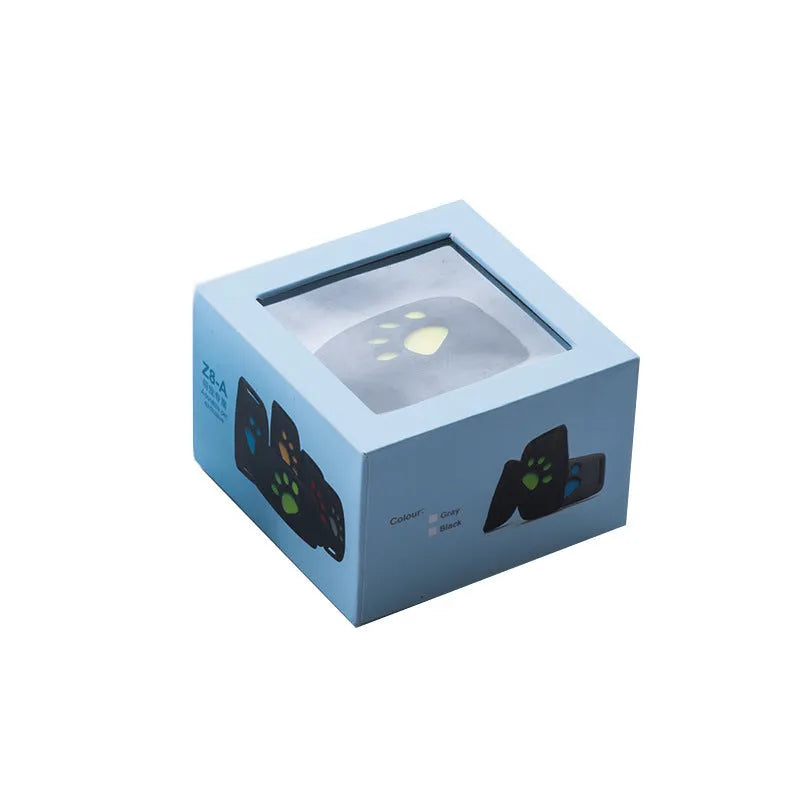 Waterproof GPS pet tracker in black, sky blue, pink, or green grass colours, showing compact 65.5mm size.