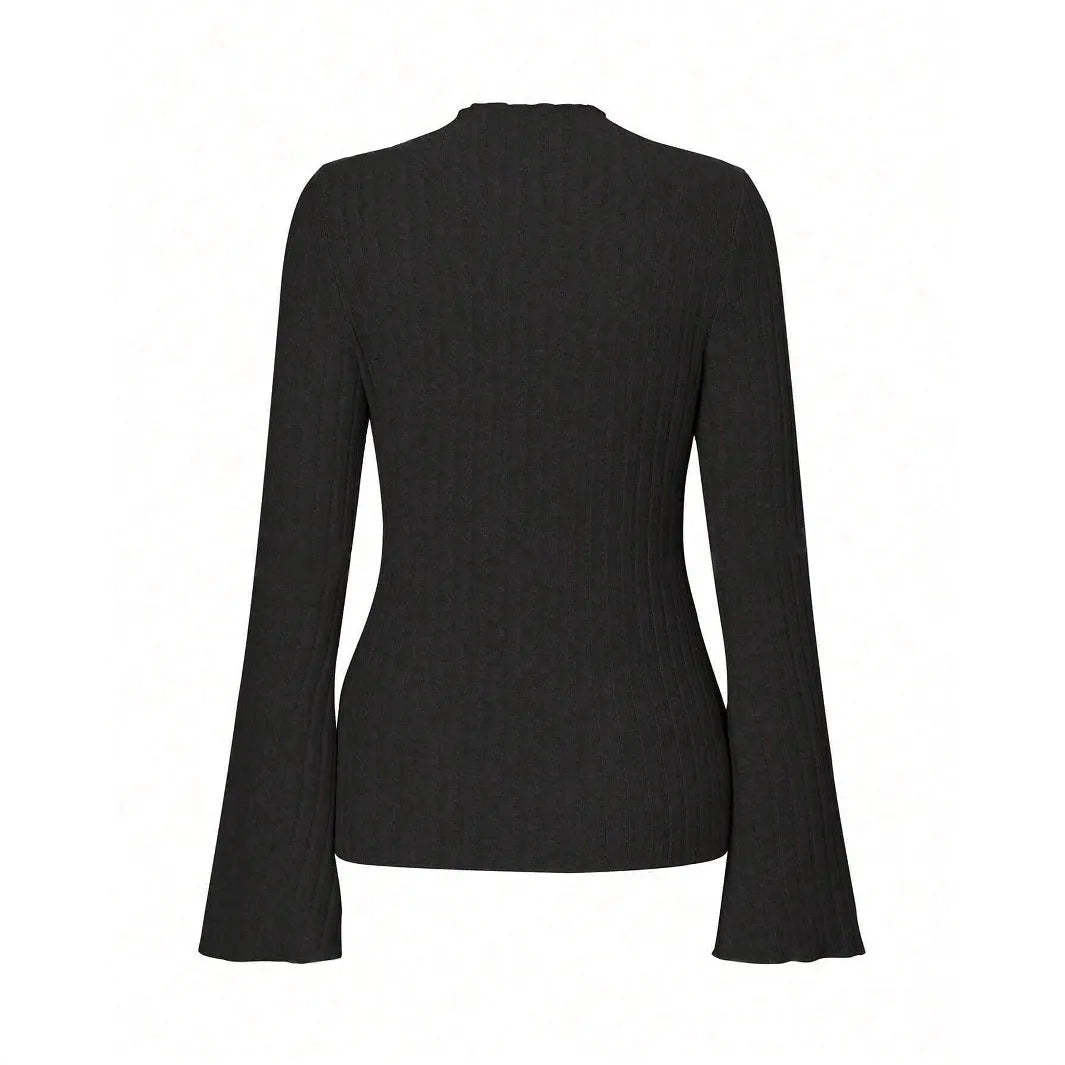 A black long sleeve slim fit top with round neck and lantern sleeves on a model.