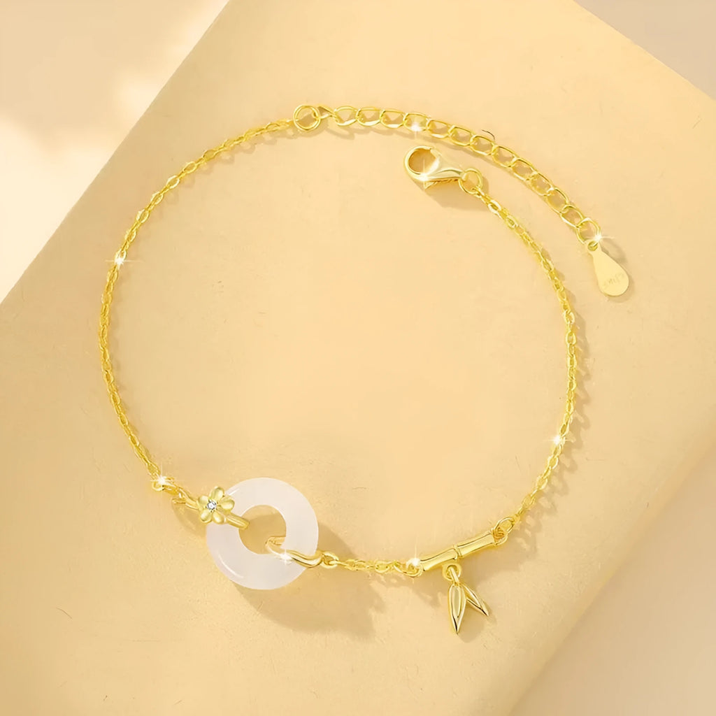 Women's silver bracelet with peace buckle clasp and white chalcedony gemstones in gold finish