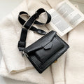 Vintage PU leather crossbody bag in black showing interior organisation for phones and wallets