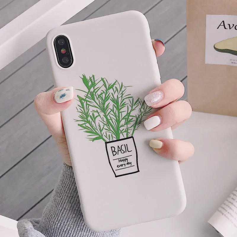 White silicone iPhone case with a painted green plant pattern on the back.