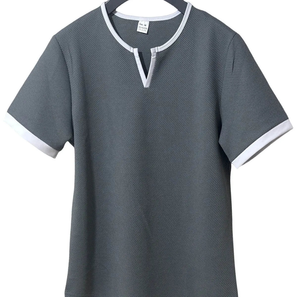 Men's colour-block V-neck short-sleeve sports T-shirt on a hanger, showing waffle texture and multiple colour options.
