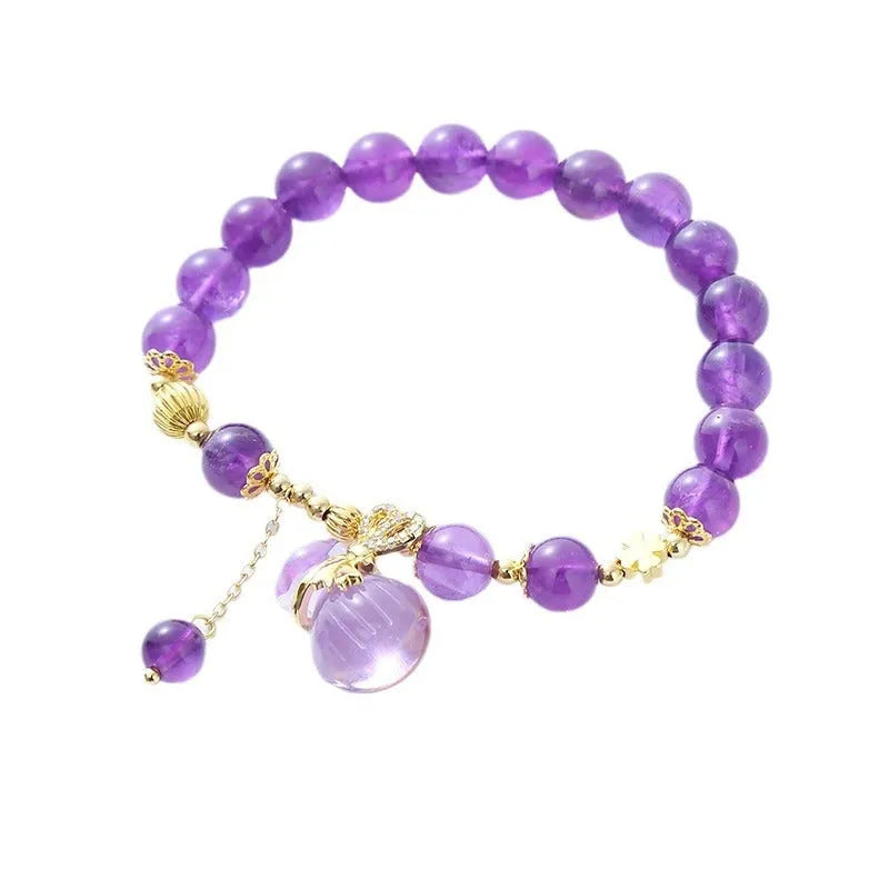 Purple amethyst bracelet with money bag pendant and peace buckle on wrist